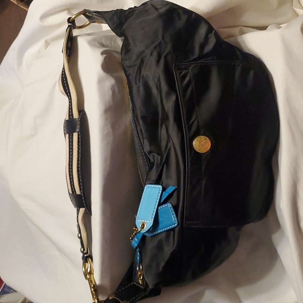 Coach: black moon-shaped bag.